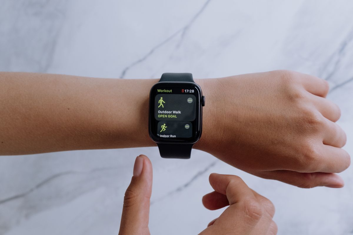 Person wearing a black smartwatch